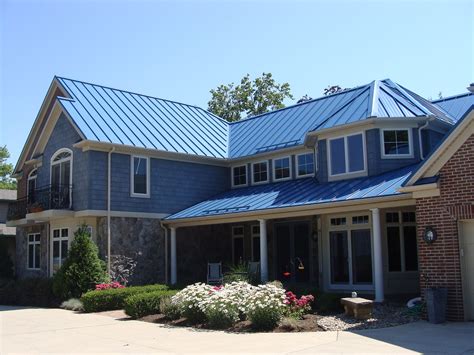 grey siding house with gallery blue metal roof|blue metal roof house exterior.